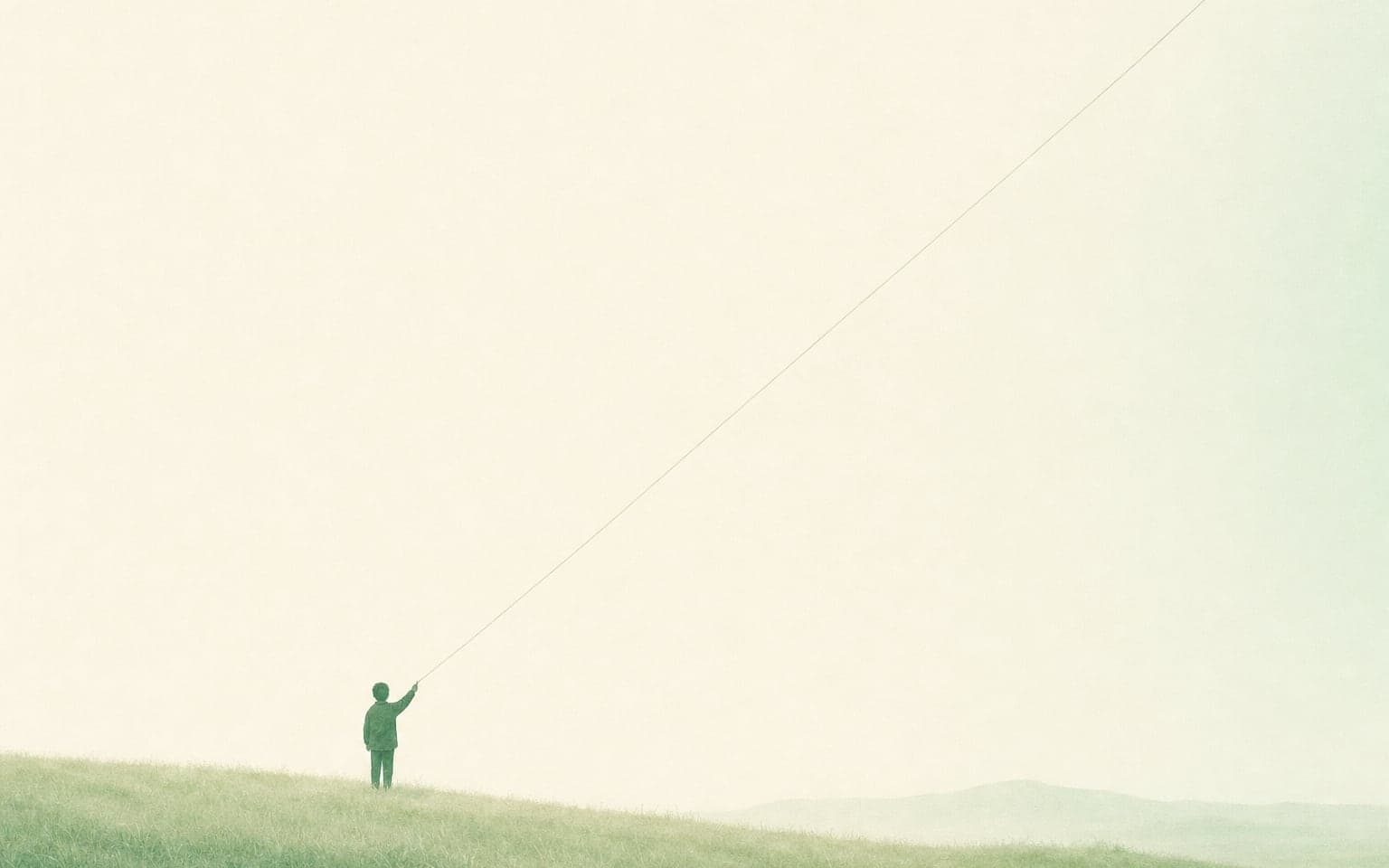 A person standing alone in a meadow, holding a line that stretches up into the sky